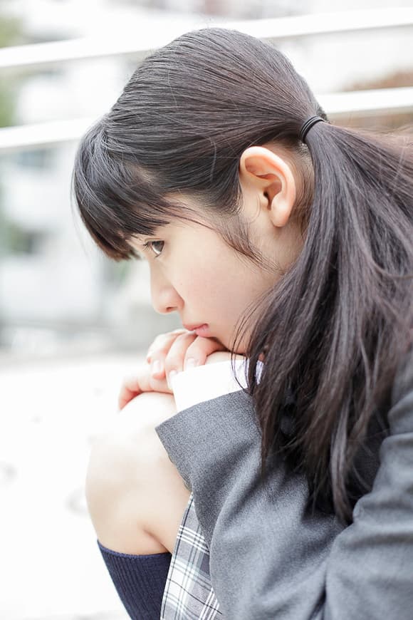 Intimate shot of a foot emerging from a cotton sock, warm tones and tactile detail highlighted